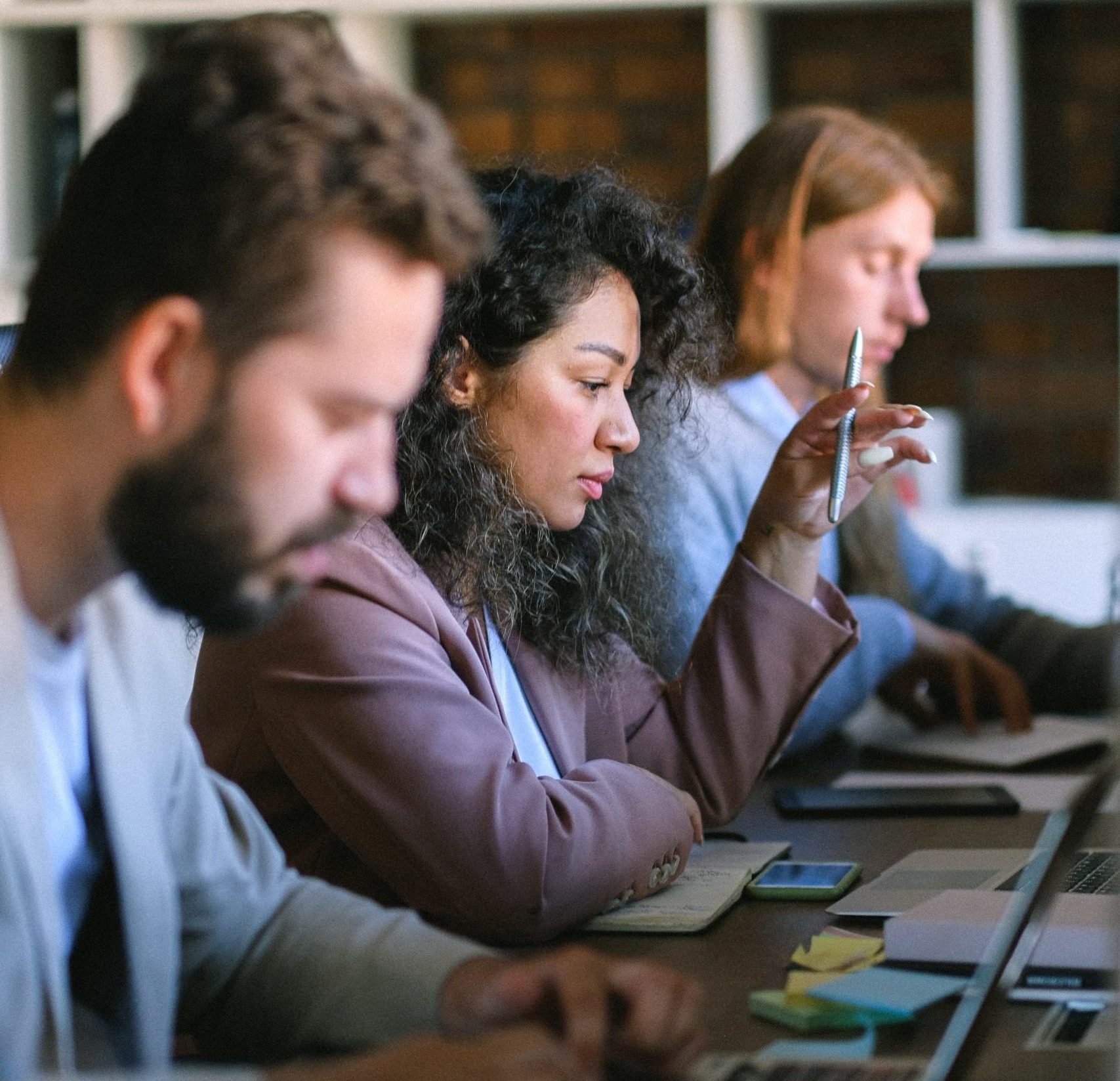 team working side by side on computers